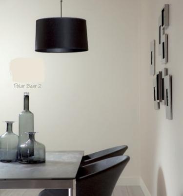 Modern Dining Area with Neutral Walls and Black Pendant Light