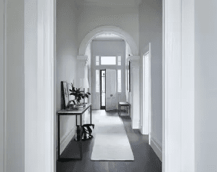 Elegant Entry Hallway with Modern Console Table and White Walls