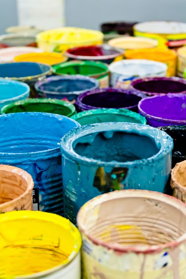 Variety of Paint Cans with Colorful Paints