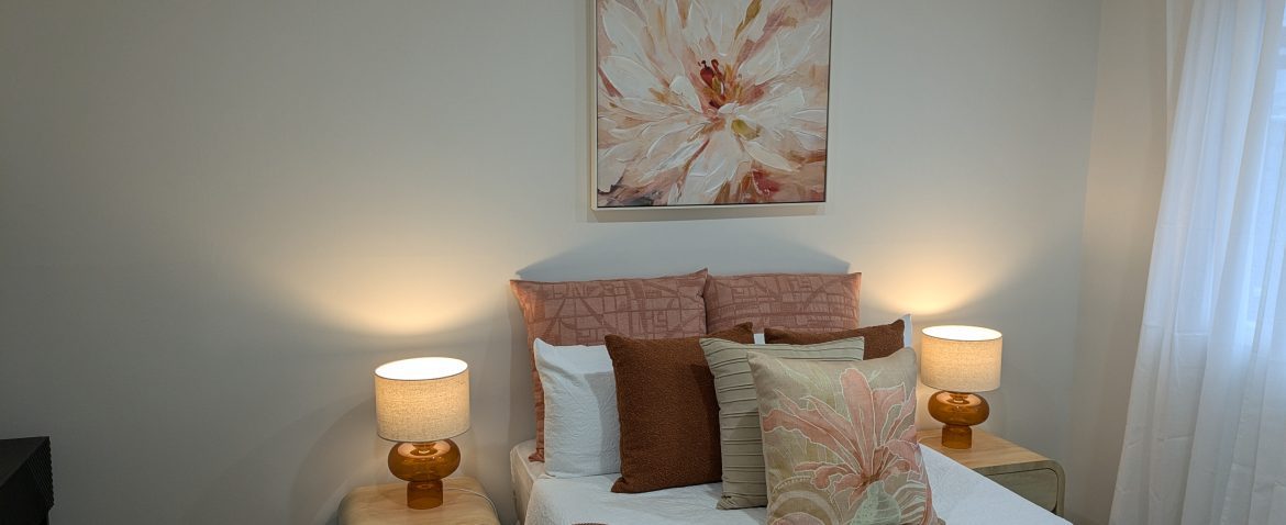 Cozy bedroom with warm-toned decor and soft lighting