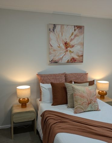 Cozy bedroom with warm-toned decor and soft lighting