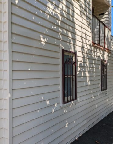 Weatherboard wall and timber window frames on Park Street, Fitzroy North, after an exterior repaint