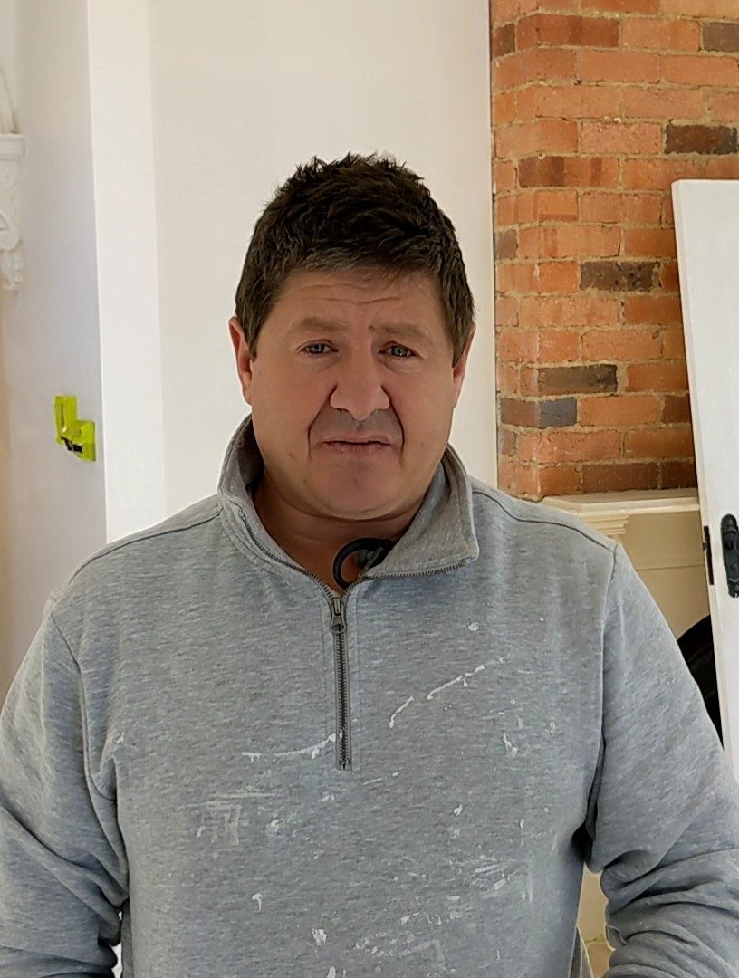Newline Painting Team Member in a Renovated Interior