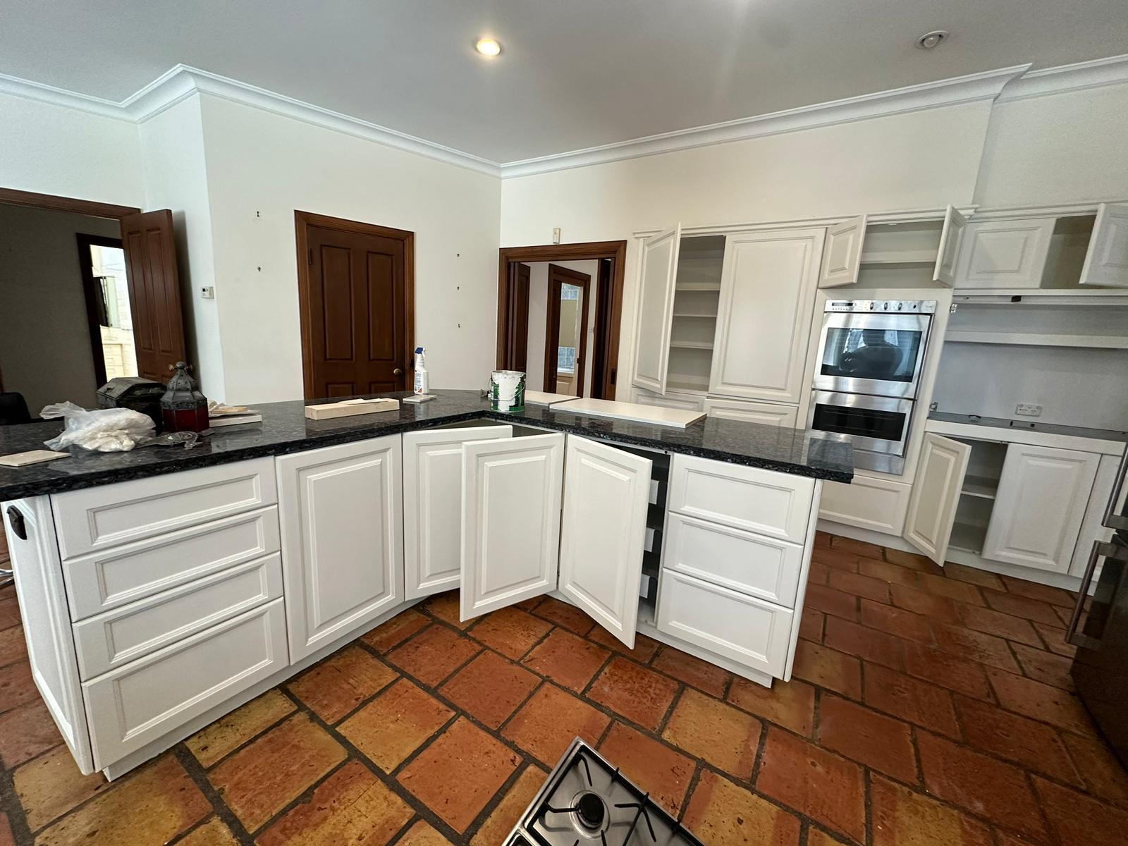 Kitchen with White Cabinets and Granite Countertops