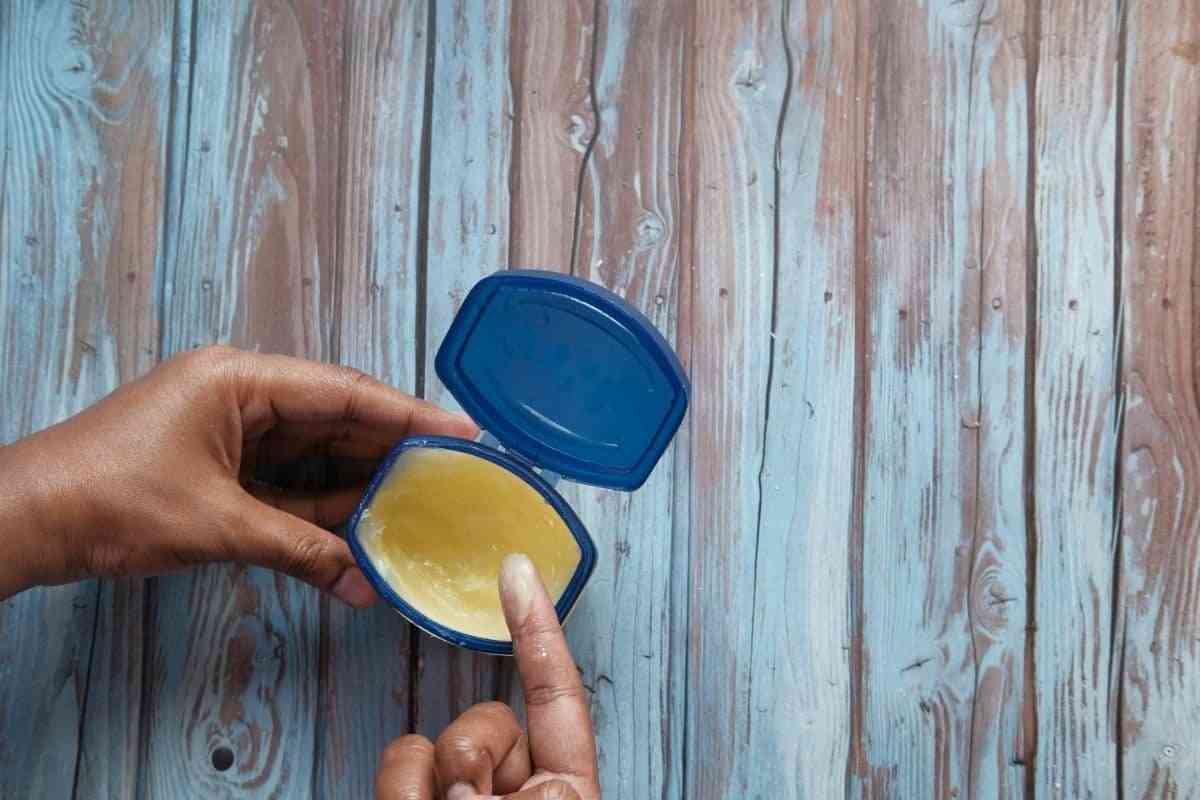 hand using petroleum jelly