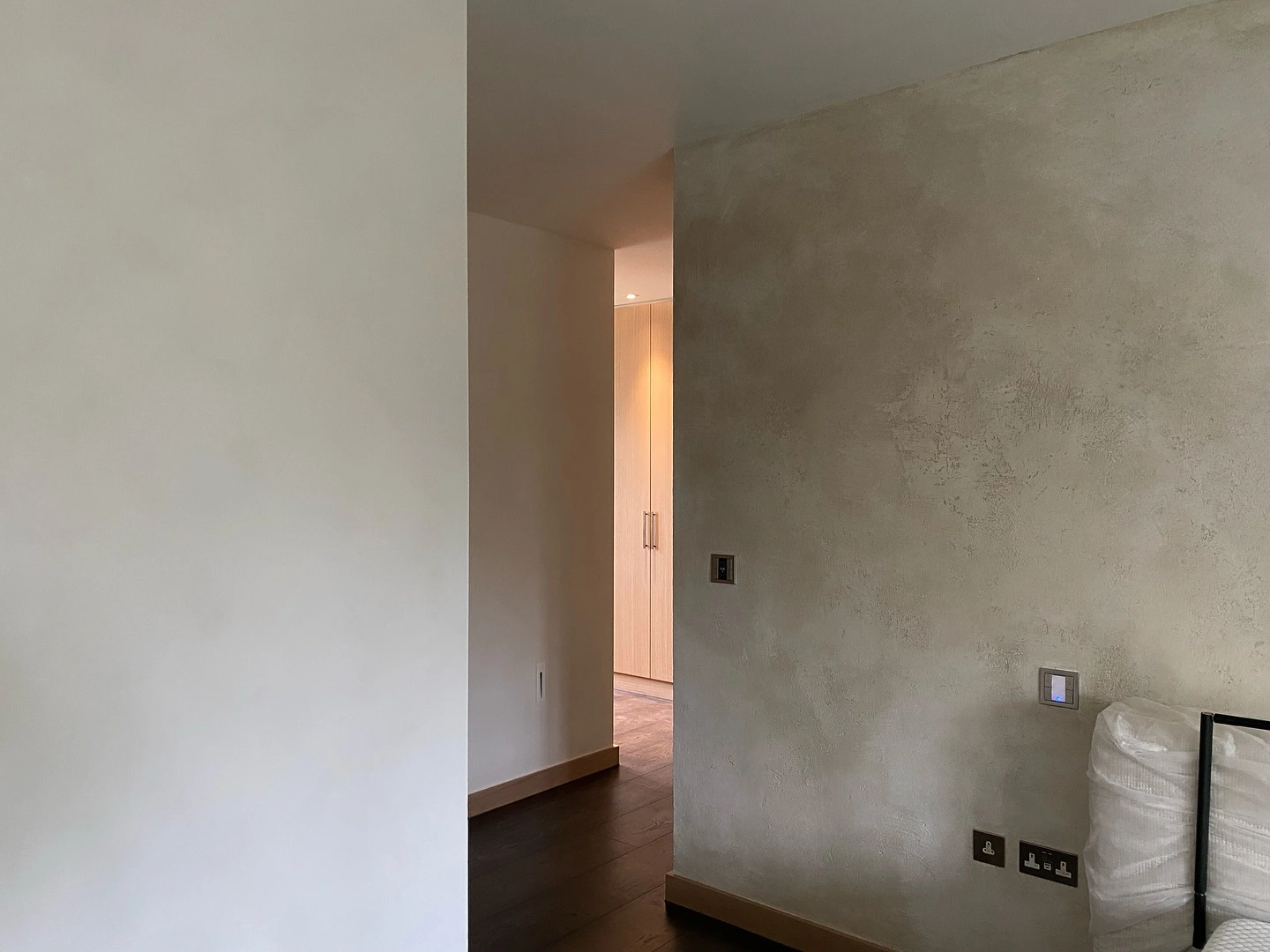 Venetian plaster bedroom walls by Newline Painting showing smooth and textured finish contrast in modern home